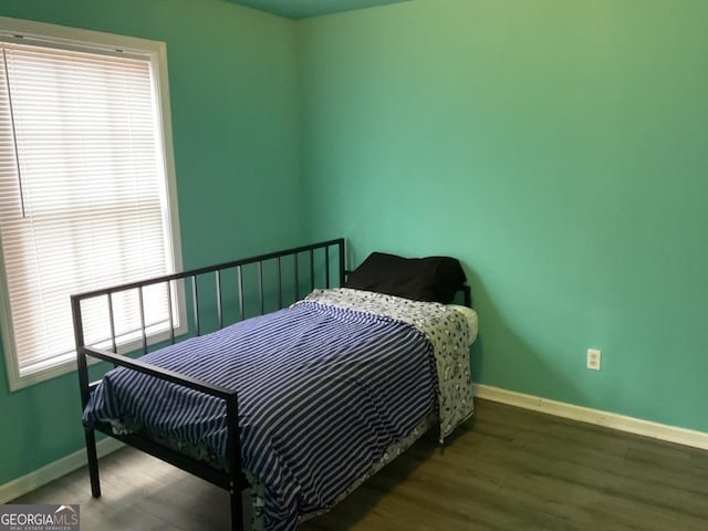 bedroom featuring dark hardwood / wood-style floors