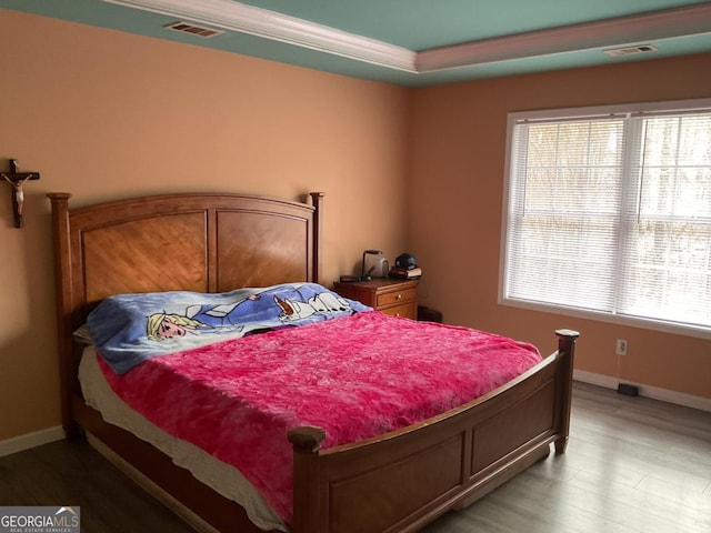 bedroom with hardwood / wood-style flooring