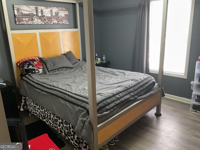 bedroom with wood-type flooring