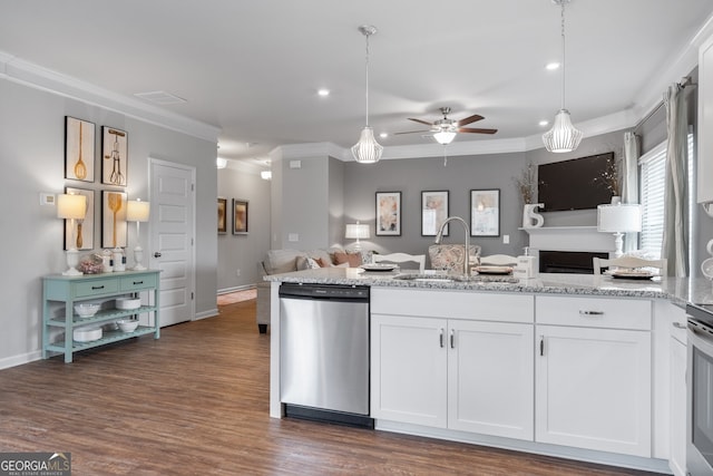 kitchen featuring sink, white cabinetry, dishwasher, pendant lighting, and light stone countertops