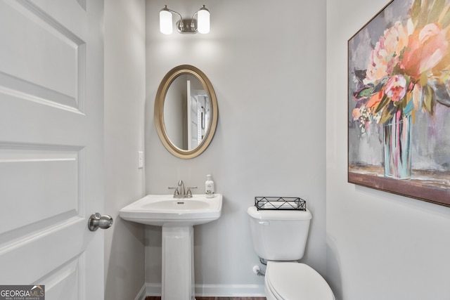 bathroom with toilet and sink