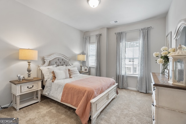 bedroom with light colored carpet