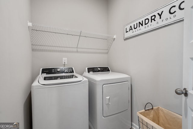 laundry room with washing machine and dryer