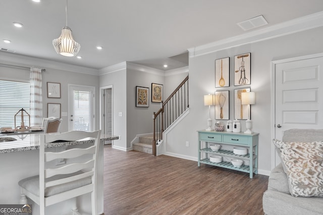 interior space with dark wood-type flooring and crown molding