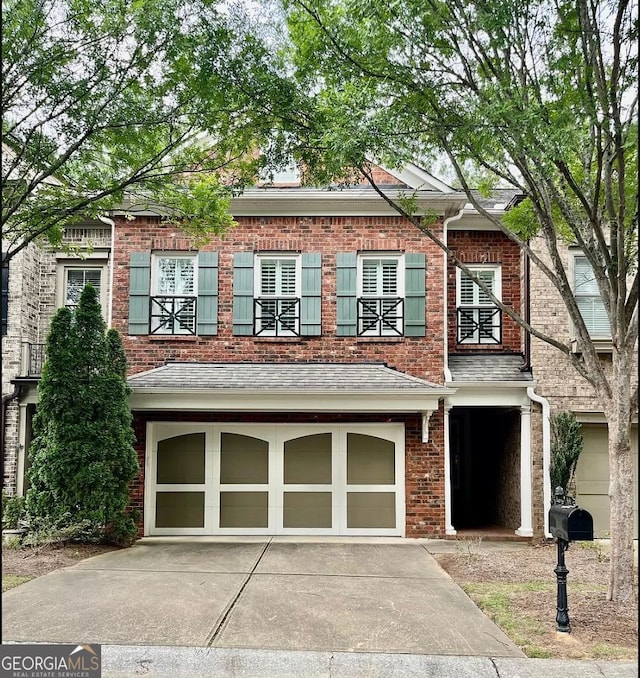 townhome / multi-family property with a garage