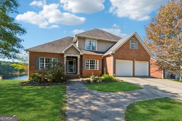 view of front of house featuring a garage and a front lawn