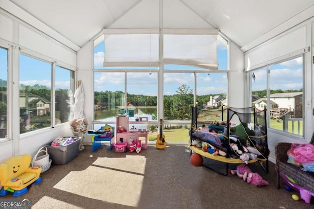 sunroom / solarium with vaulted ceiling and a water view