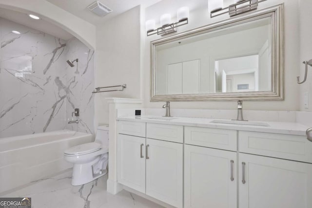 full bathroom featuring vanity, toilet, and tiled shower / bath combo