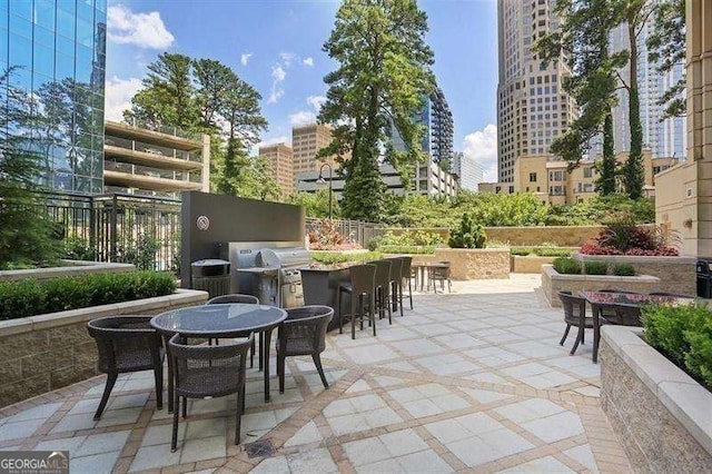 view of patio / terrace with a bar and grilling area