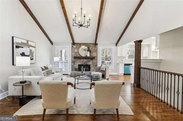 living room featuring beam ceiling, high vaulted ceiling, hardwood / wood-style floors, and a fireplace