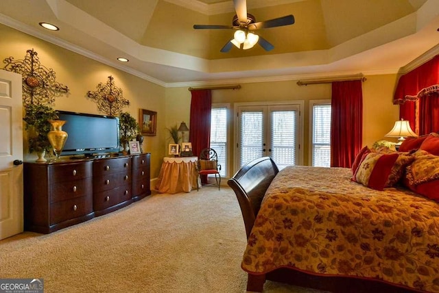 carpeted bedroom featuring a raised ceiling, crown molding, access to exterior, and ceiling fan