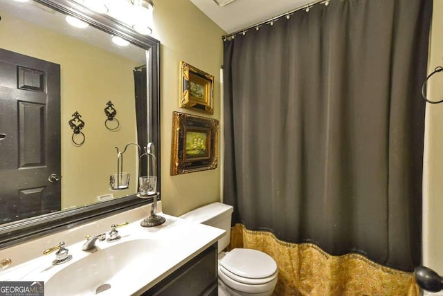 bathroom with vanity and toilet