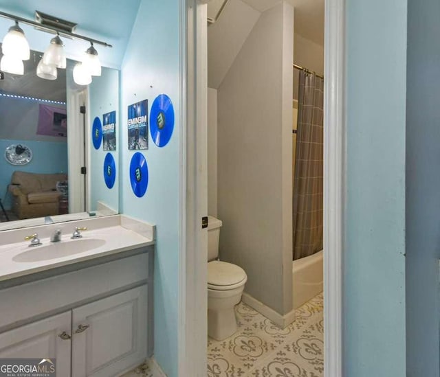 full bathroom featuring shower / bathtub combination with curtain, tile patterned floors, vanity, and toilet