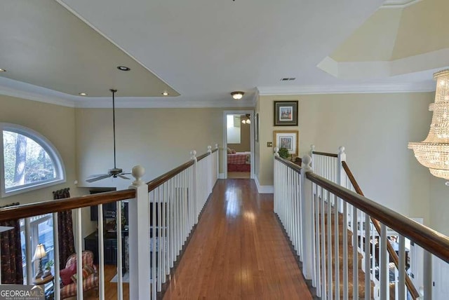 corridor featuring hardwood / wood-style flooring and ornamental molding