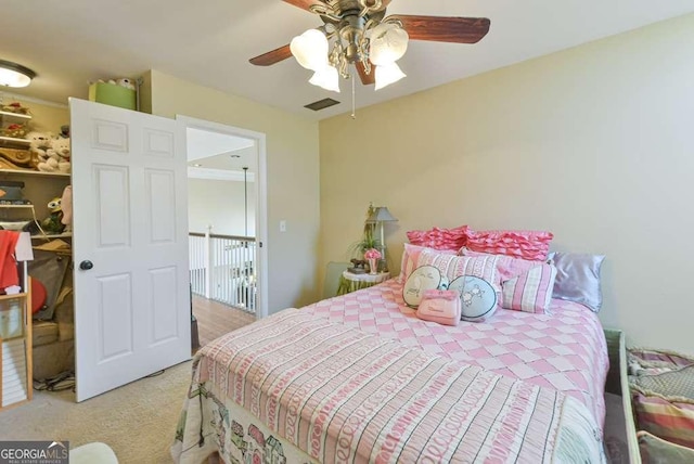 bedroom with ceiling fan and light colored carpet