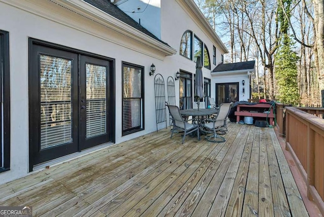 wooden deck featuring french doors