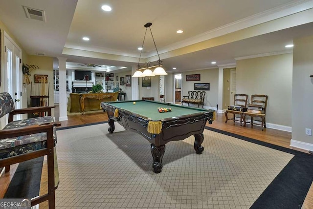 playroom with pool table, a tray ceiling, ornamental molding, and hardwood / wood-style flooring