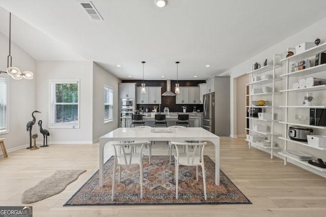 dining space with light hardwood / wood-style floors