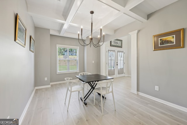 dining space featuring french doors, beamed ceiling, coffered ceiling, and light wood-type flooring