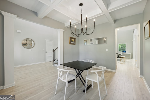 dining room with coffered ceiling, light wood-type flooring, a notable chandelier, beam ceiling, and decorative columns