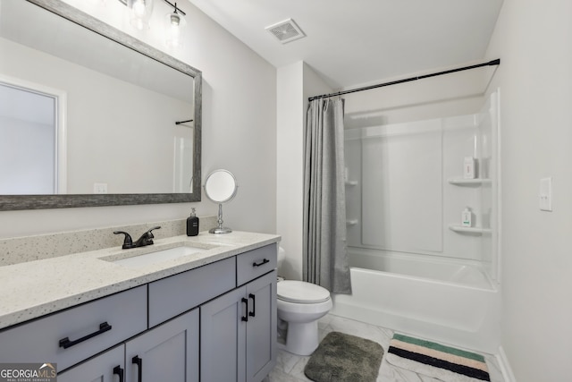 full bathroom featuring vanity, toilet, and shower / tub combo