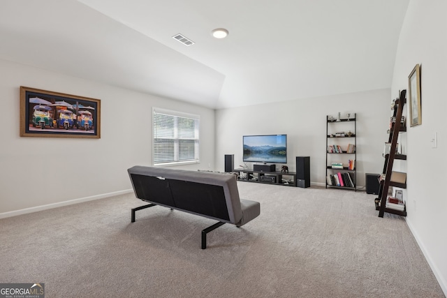 living room featuring light colored carpet and lofted ceiling