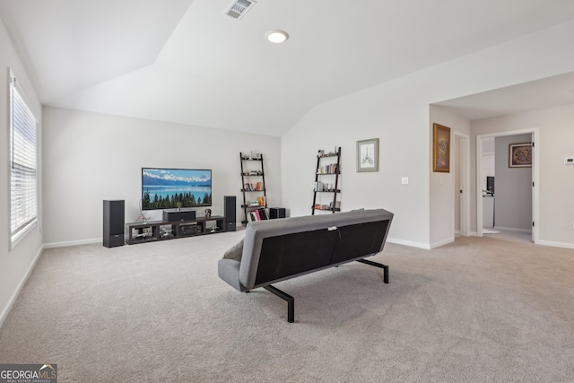 playroom with lofted ceiling and light carpet