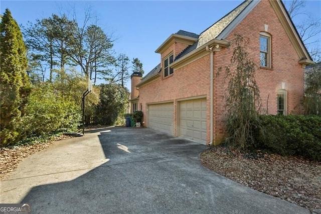 view of side of property featuring a garage