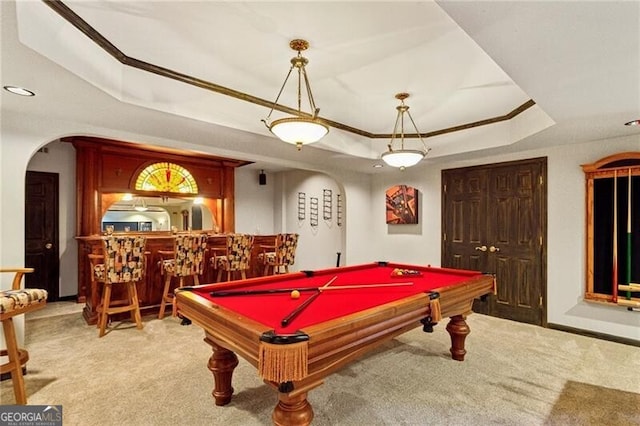 playroom with a raised ceiling, carpet, pool table, and indoor bar