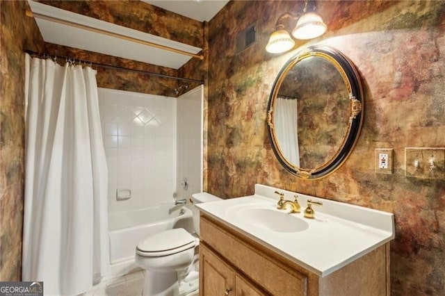 full bathroom with vanity, toilet, and shower / bath combo with shower curtain