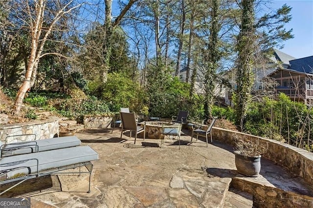 view of patio with a fire pit