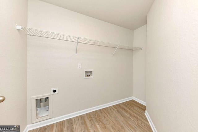 laundry area with wood-type flooring, hookup for an electric dryer, and hookup for a washing machine