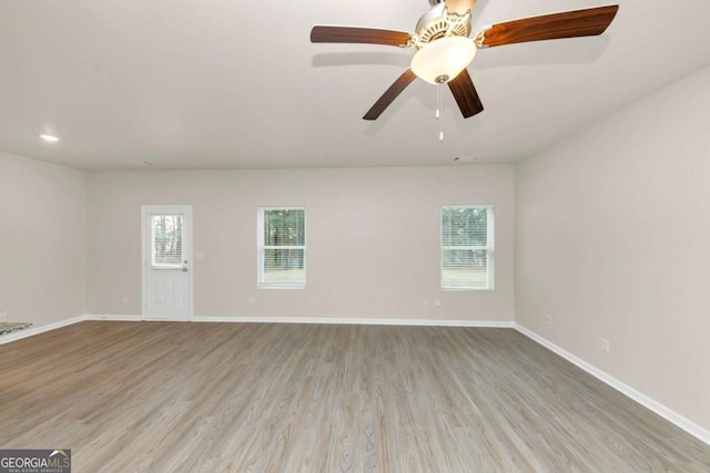 empty room featuring light hardwood / wood-style flooring and a healthy amount of sunlight