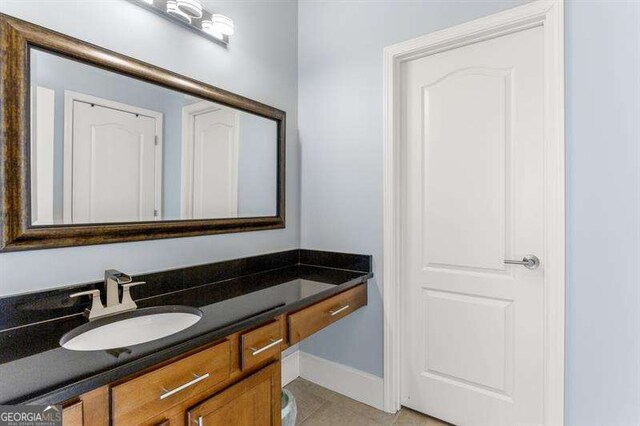 bathroom with vanity and tile patterned flooring