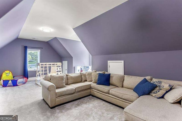 living room featuring vaulted ceiling and carpet