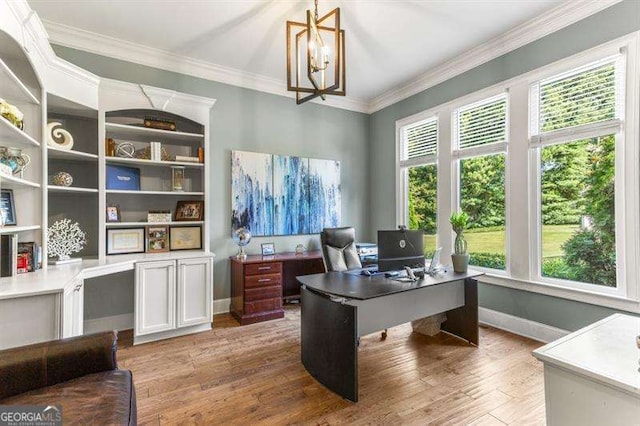 office with ornamental molding, hardwood / wood-style floors, and a chandelier