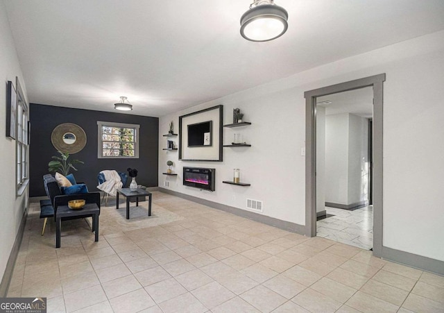 living area featuring light tile patterned floors