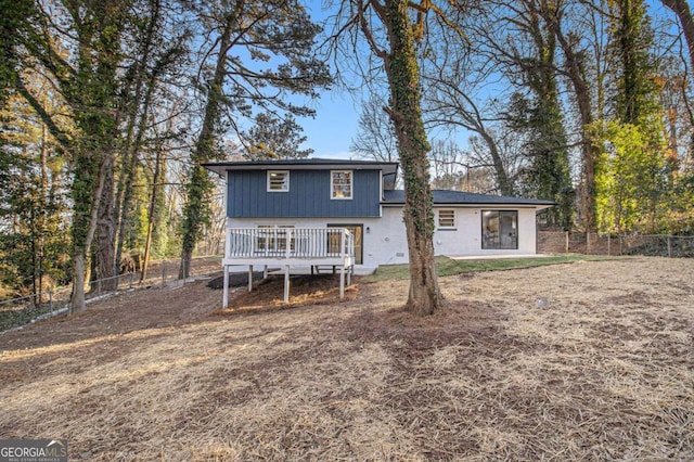 rear view of house featuring a deck