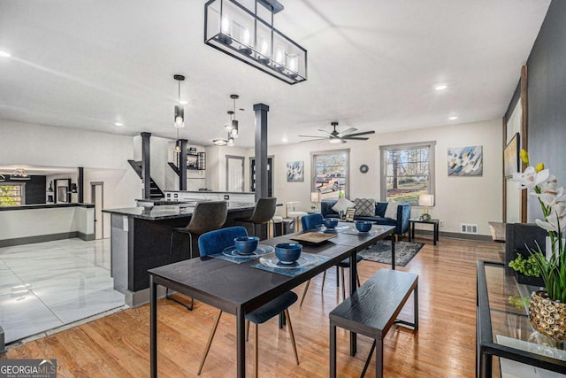 dining room featuring light hardwood / wood-style floors and ceiling fan