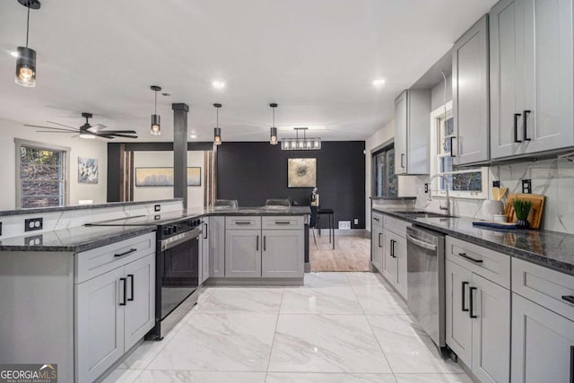 kitchen with pendant lighting, sink, dishwasher, gray cabinetry, and electric range