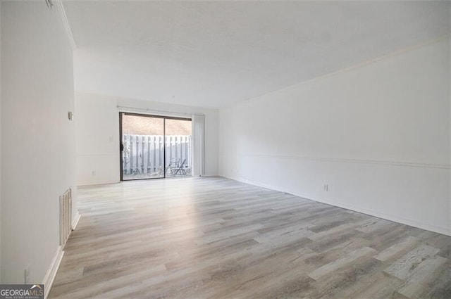 empty room with light wood-type flooring