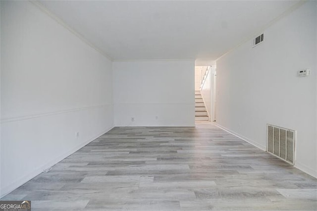 spare room featuring light hardwood / wood-style floors