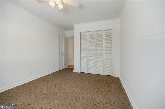 unfurnished bedroom featuring ornamental molding, a closet, and ceiling fan