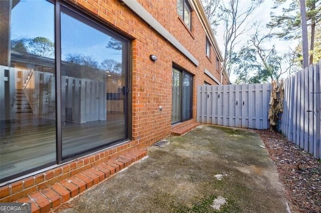 view of property exterior featuring a patio area