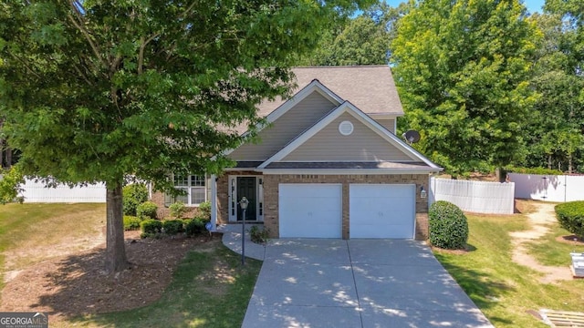 view of front of house with a garage and a front lawn