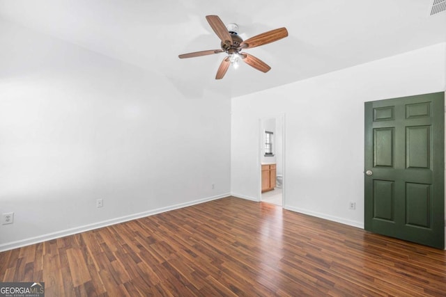 unfurnished living room with dark wood-type flooring and ceiling fan