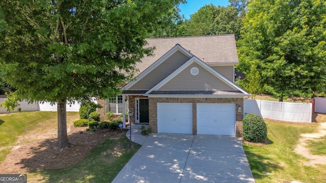 view of front of property with a garage and a front lawn