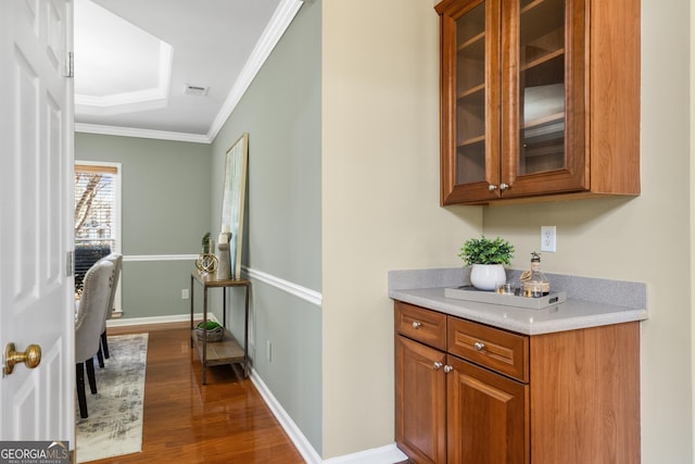 interior space featuring ornamental molding and dark hardwood / wood-style floors