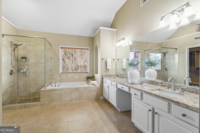 bathroom with tile patterned floors, lofted ceiling, shower with separate bathtub, and vanity