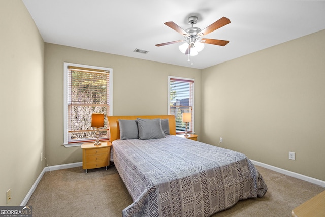 carpeted bedroom featuring ceiling fan